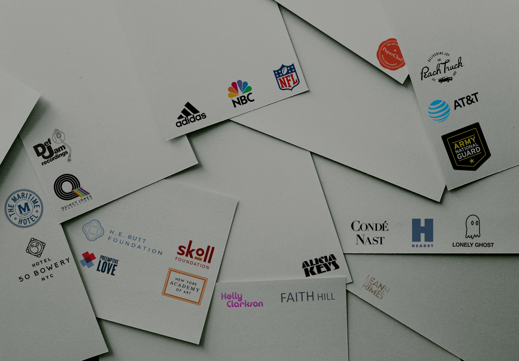 Scattered business cards featuring logos of NFL, NBC, Adidas, Alicia Keys, Def Jam, and other Waterloo Digital clients